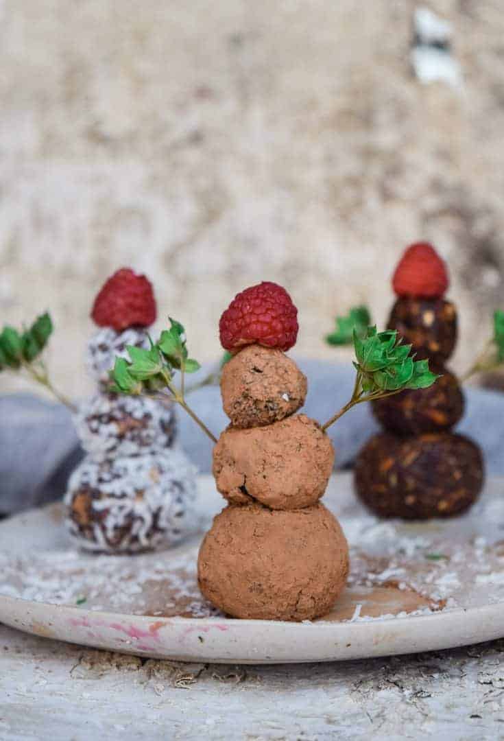 Gingerbread Protein Bites stacked to look like snowmen