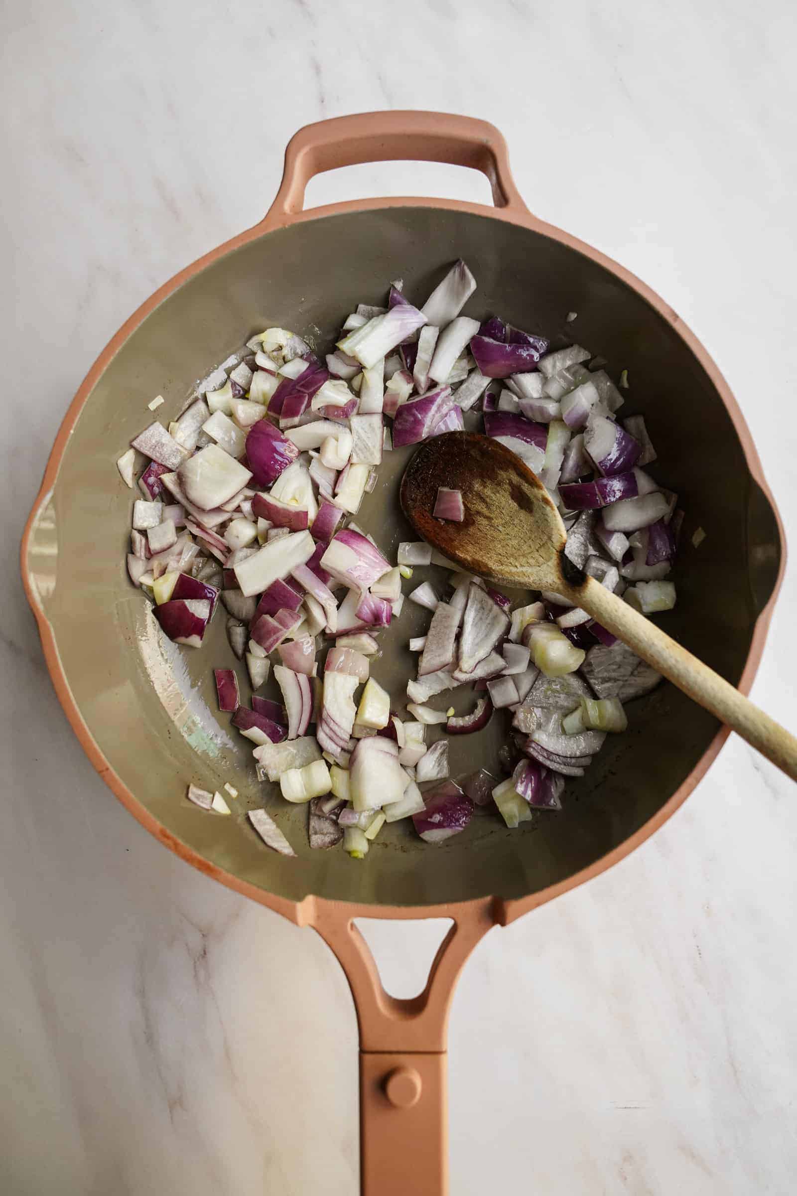 Onions in pan for vegan pasta sauce