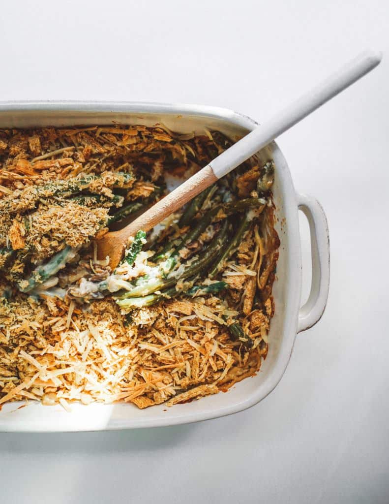 Green bean casserole with a serving spoon in it