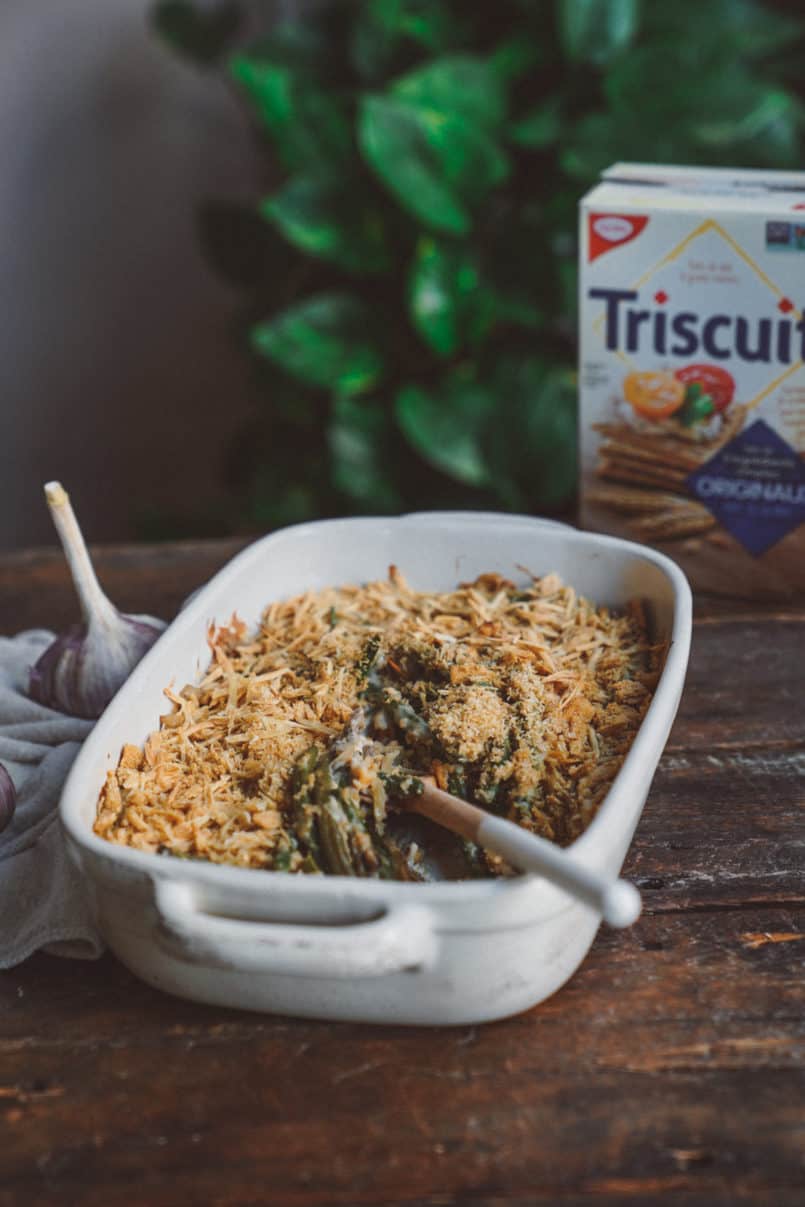 Green bean casserole in a dish with a serving spoon in it