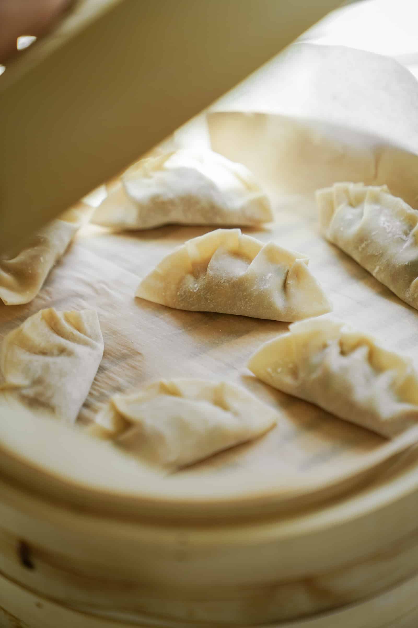 Vegan potstickers in a bowl ready to be cooked