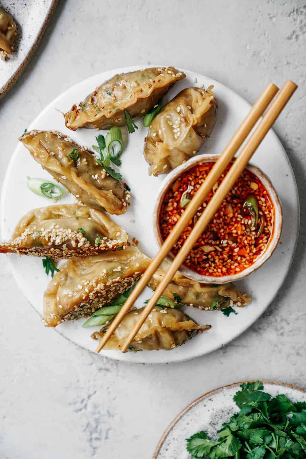 Bowl of vegan potstickers with chopsticks