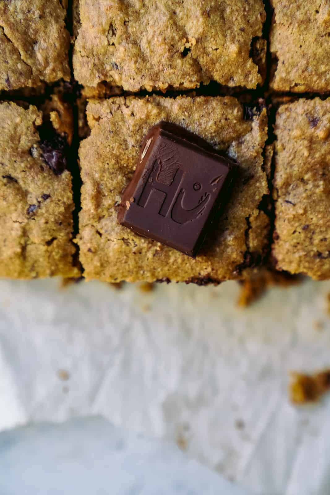 Close-up of vegan chocolate on top of vegan blondies.