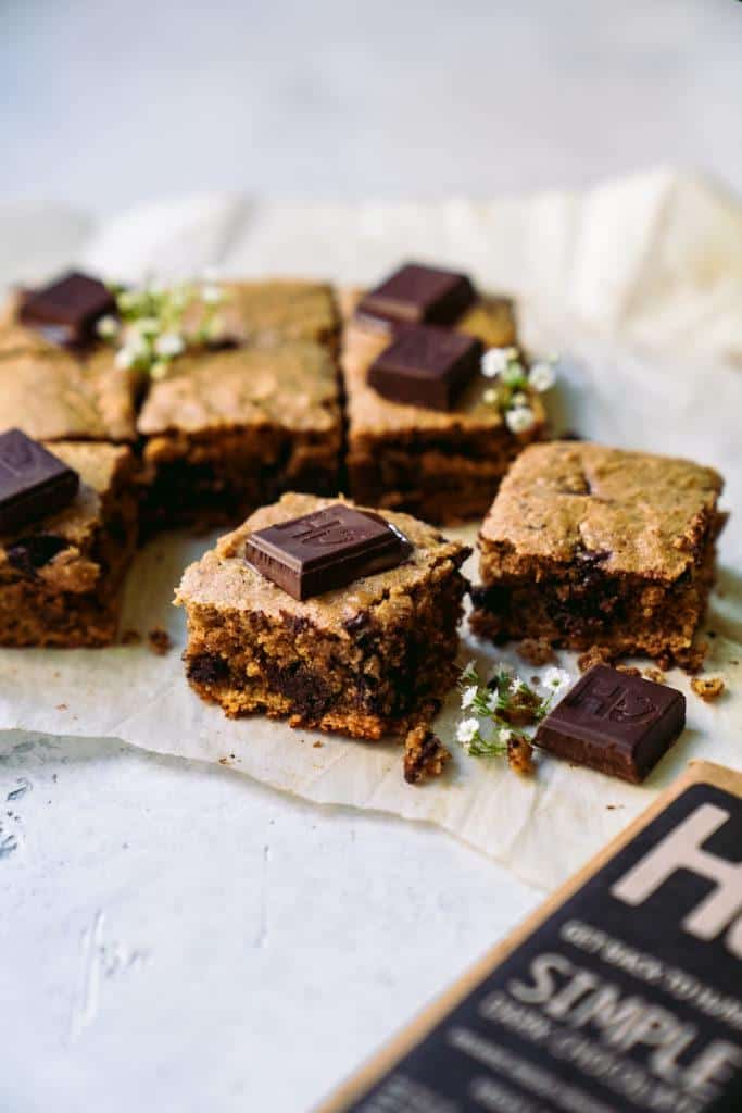 Pieces of Vegan Blondies with chocolate chunks.