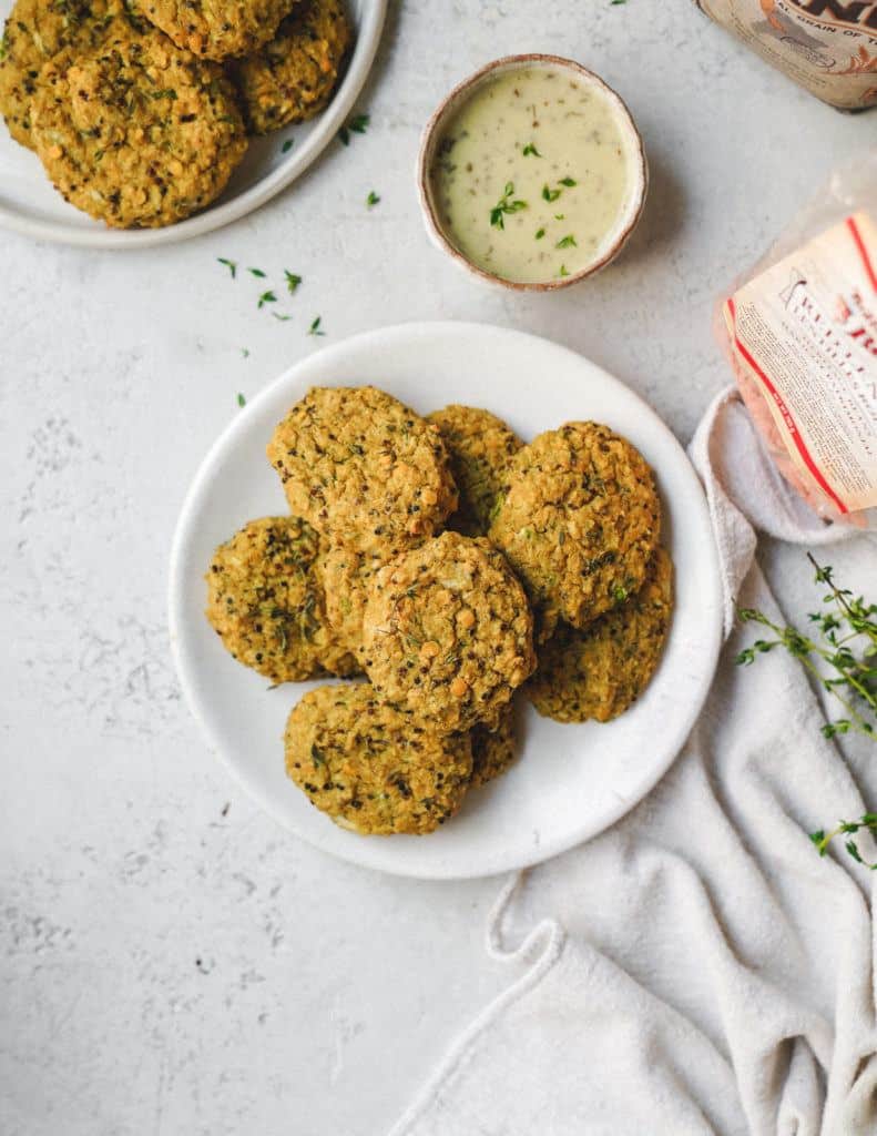 Vegetable fritters on serving dish on table.