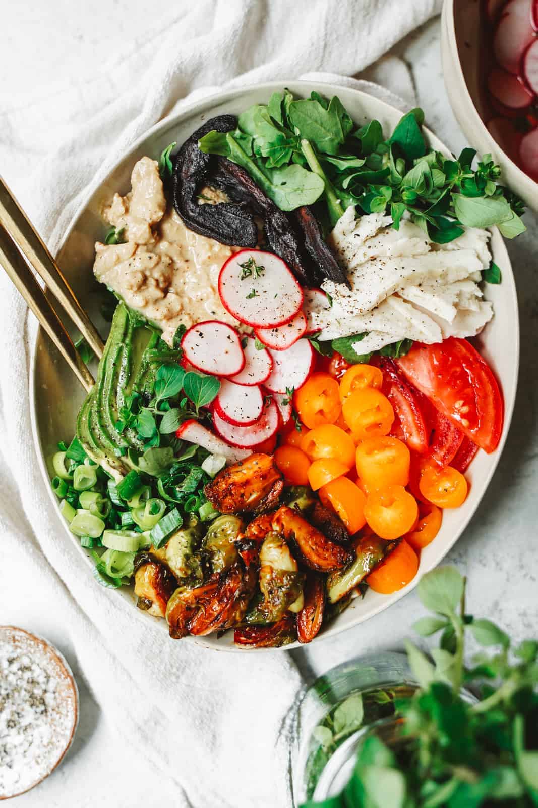 A colorful vegan cobb salad in a serving dish.