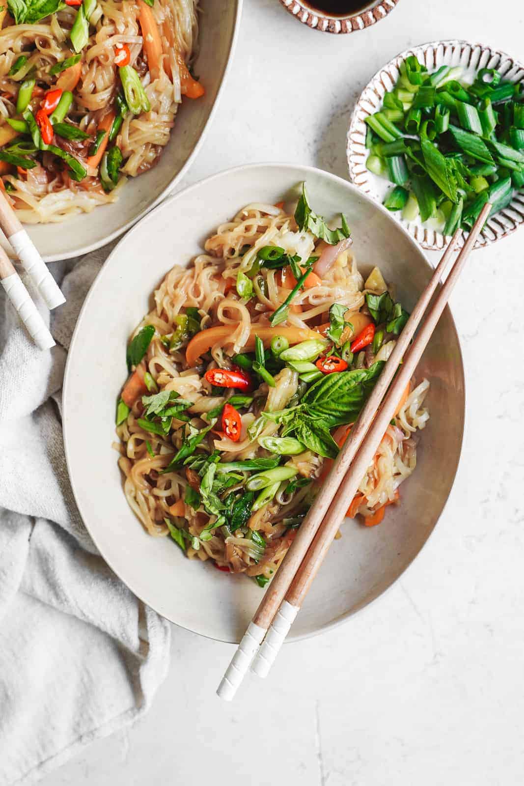 Easy 15-minute drunken noodles in bowl with chopsticks ready to eat.