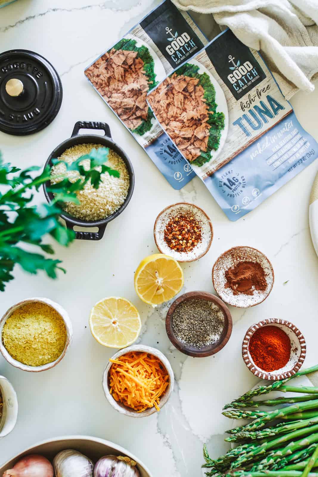 Plant based tuna with ingredients surrounding it on countertop.