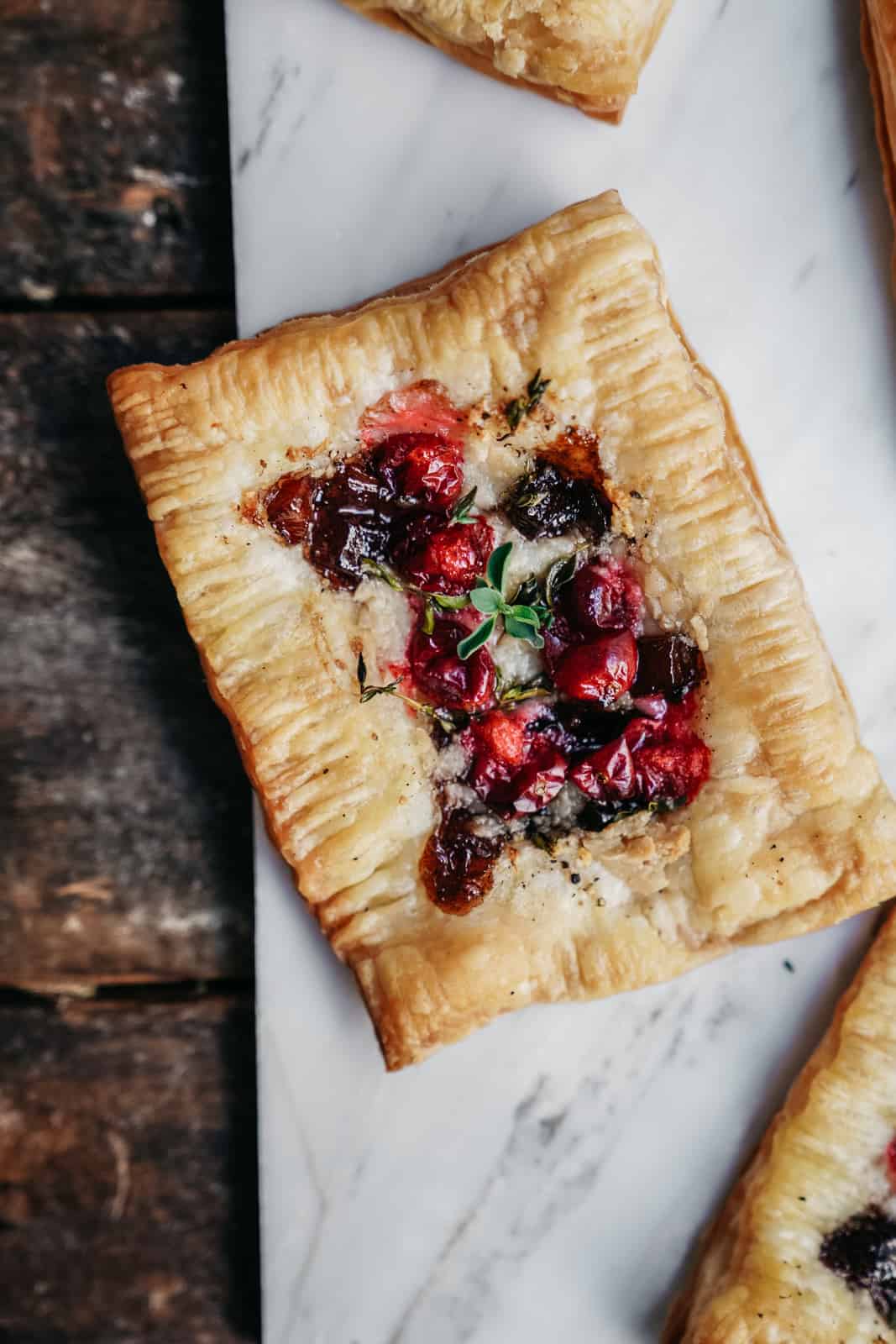 vegan cranberry cheese tarts on cutting board