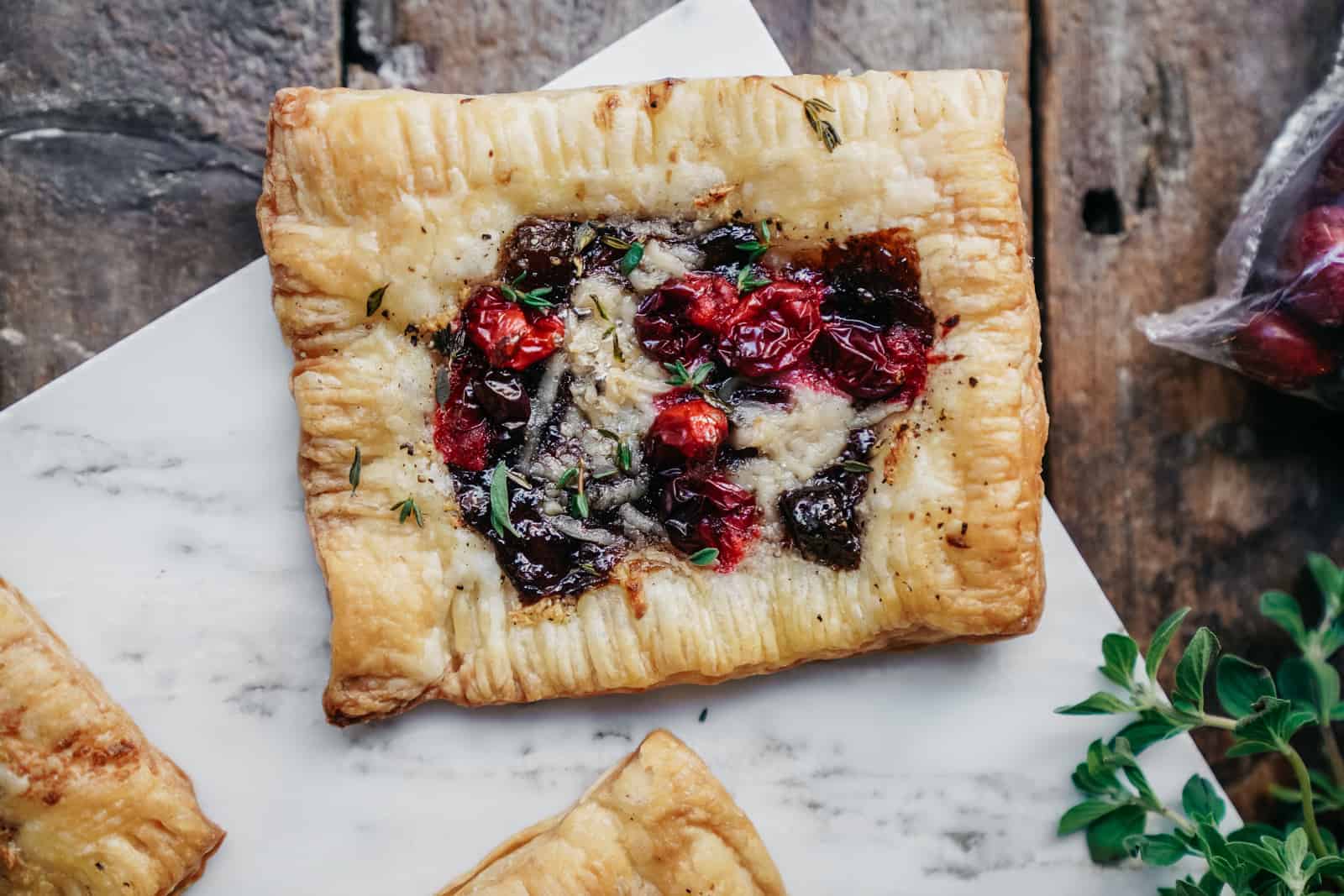 vegan cranberry cheese tarts on cutting board