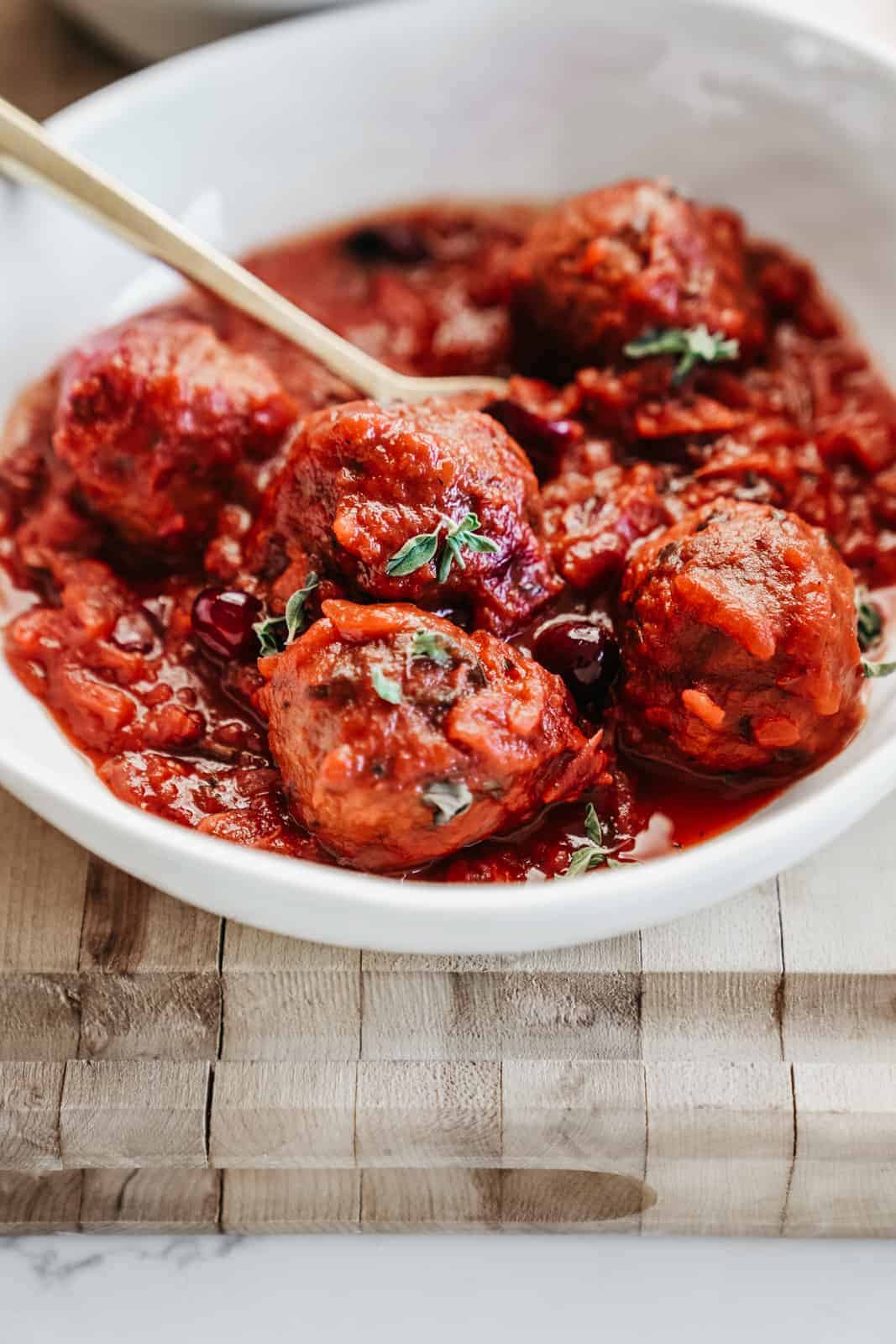 Yummy cranberry sauce meatballs in a serving dish.