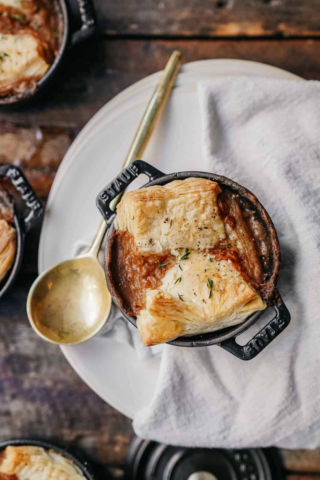 Super easy, vegan pot pie. Perfect for a comforting plant-based meal in the fall or winter. In a serving dish, on a tablecloth.