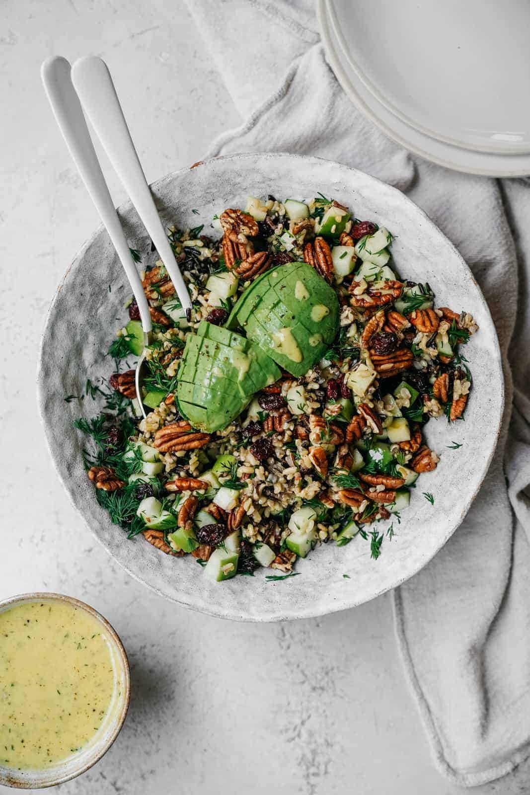 High Protein Vegan Meal Prep recipe for a colourful salad sitting in a big bowl on white countertop.