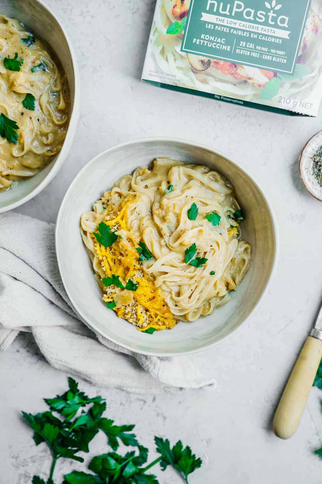 Cauliflower Cheese Sauce on top of Nupasta in big white pasta bowls