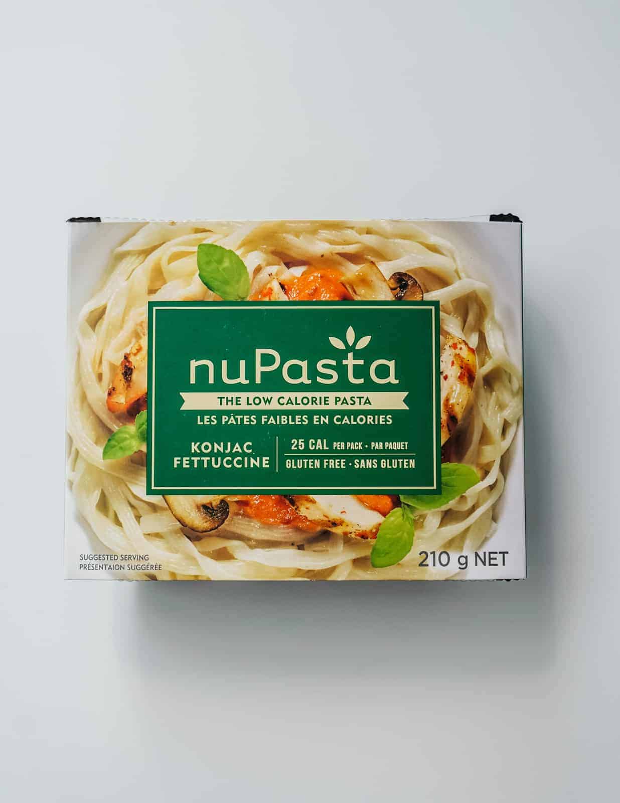 NuPasta in a box on a white countertop.