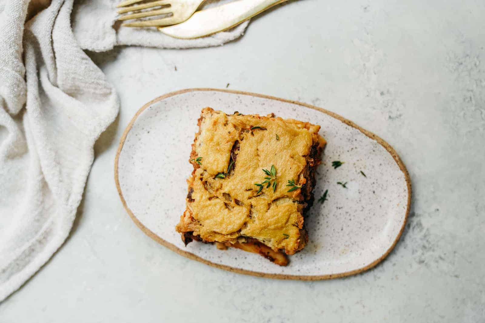 Top view of the Greek Pastitsio on a white dish.