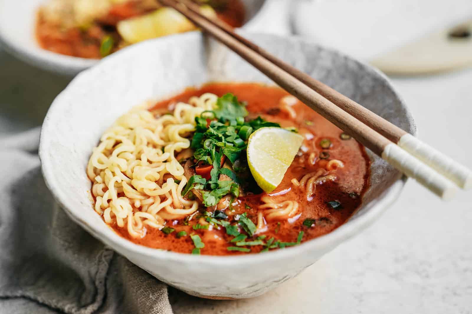 Easy Curry Vegetarian Ramen Recipe in serving bowls with chopsticks