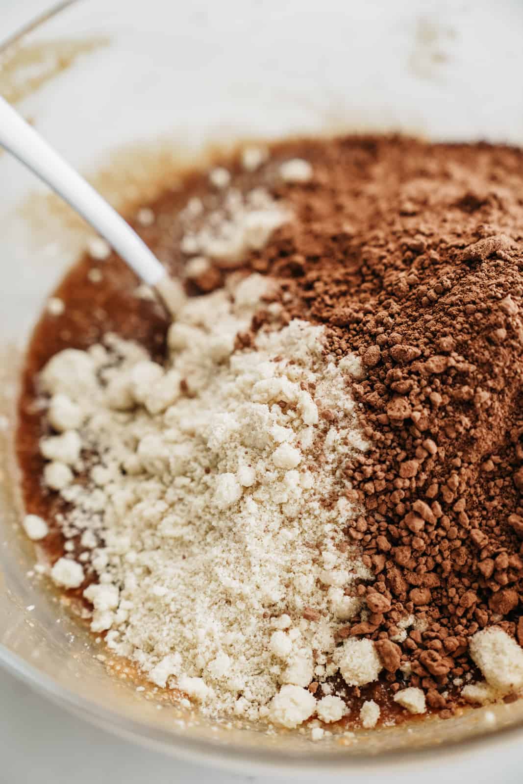 Powdered ingredients added into the wet ingredients for Almond Flour Brownies.