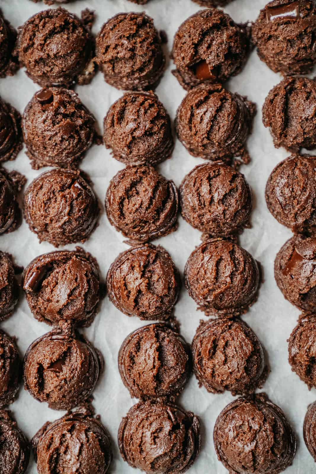 Protein cookies lined up on a baking sheet