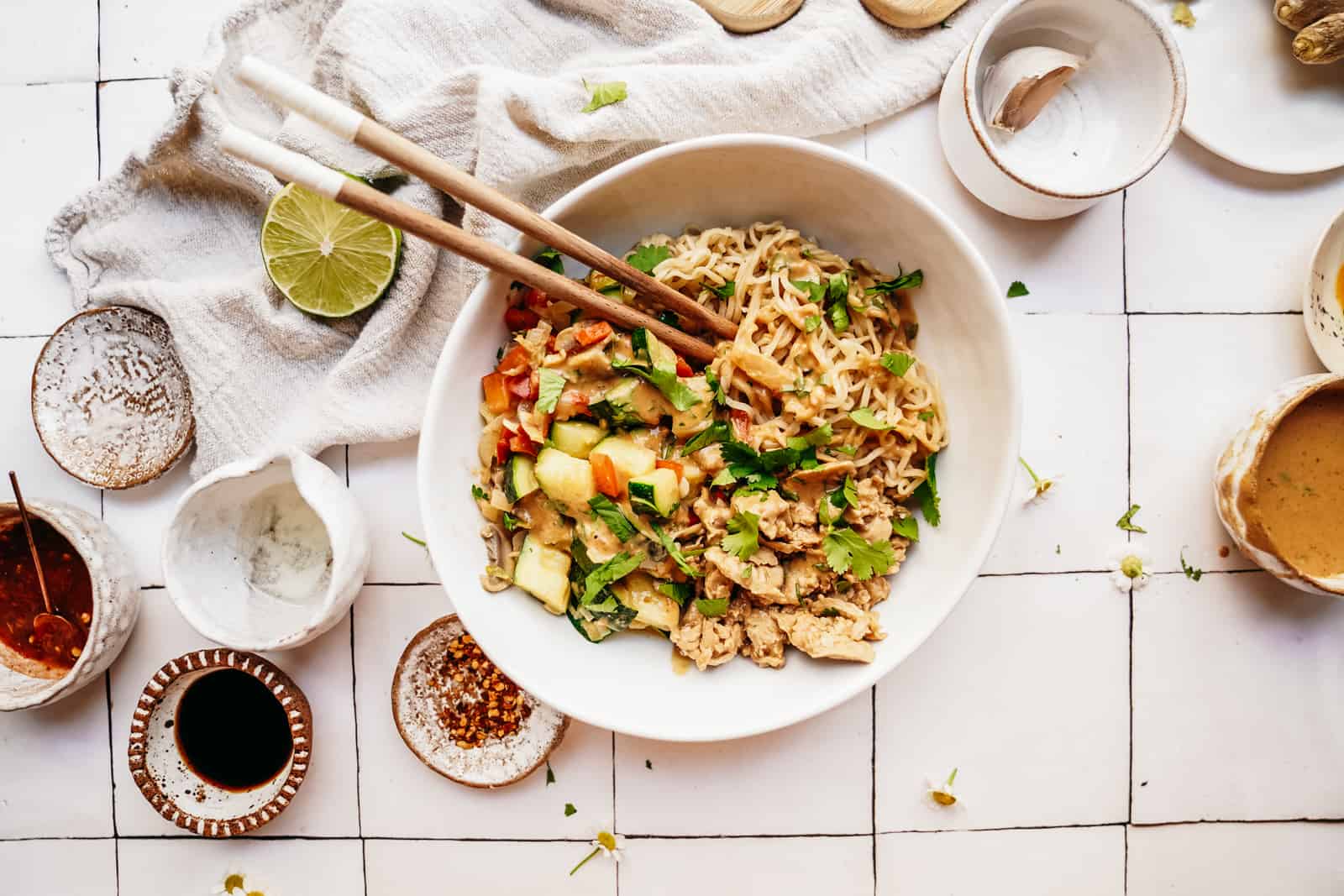 Ramen Noodles and Tuna on a counter surrounded by ingredients