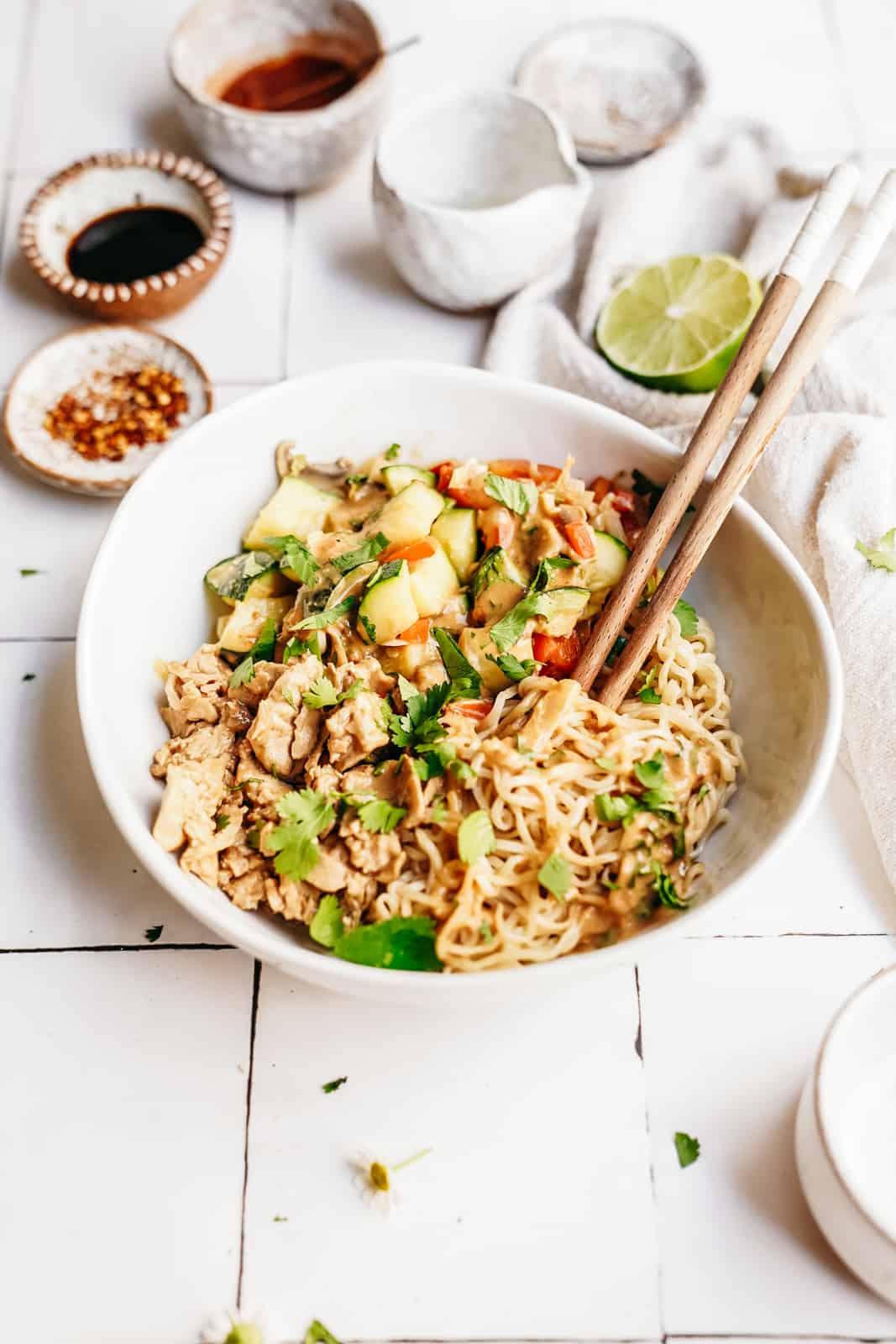 Ramen noodles and tuna in a bowl with chopsticks