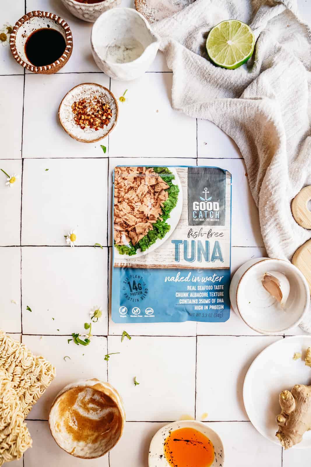 Vegan tuna packet on a counter surrounded by ingredients