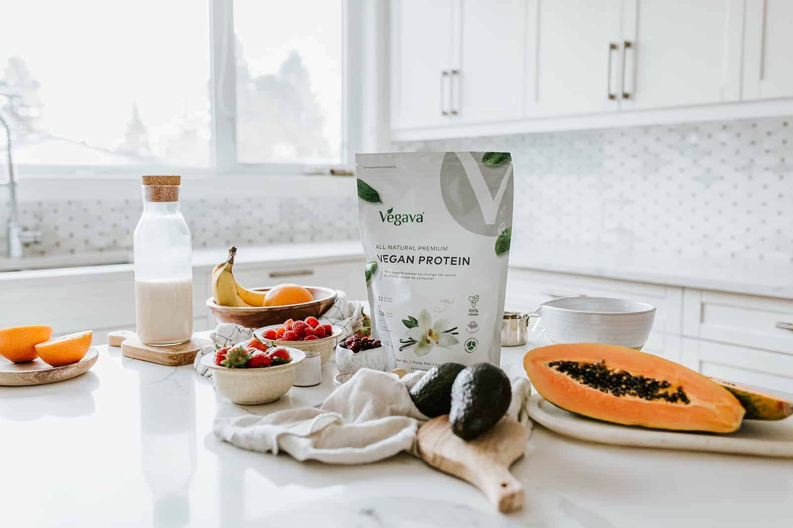 Bag of protein powder on counter surrounded by other ingredients