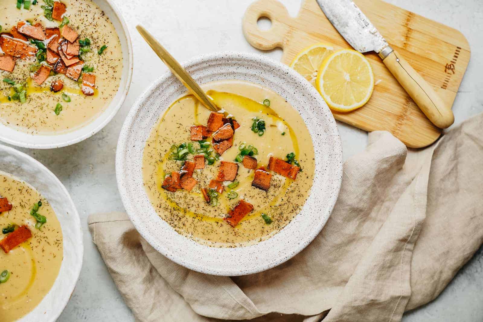 Bowls of vegan potato soup, creamy, hot, and ready to serve. 