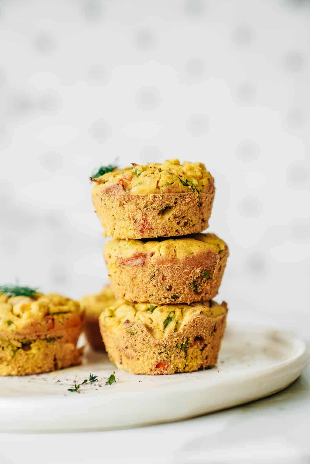 Stack of Vegan Chickpea Flour Muffins on a plate.