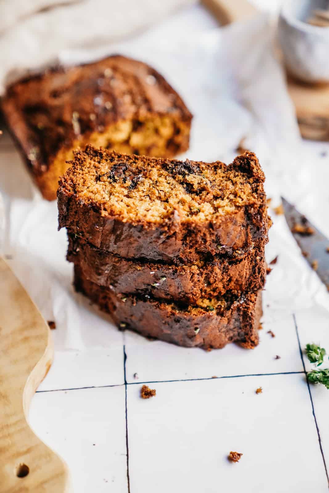 Stack of Zucchini Banana Bread on countertop ready to be enjoyed.