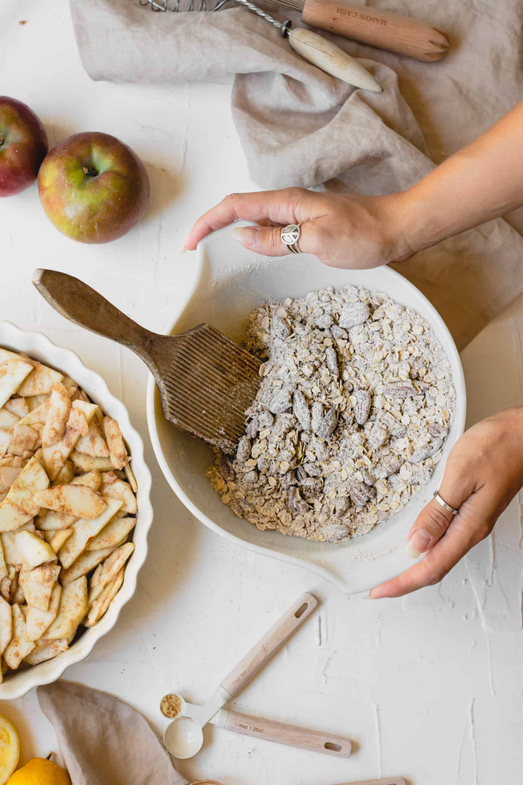 Dry ingredients for Vegan Apple Crumble in white bowl.