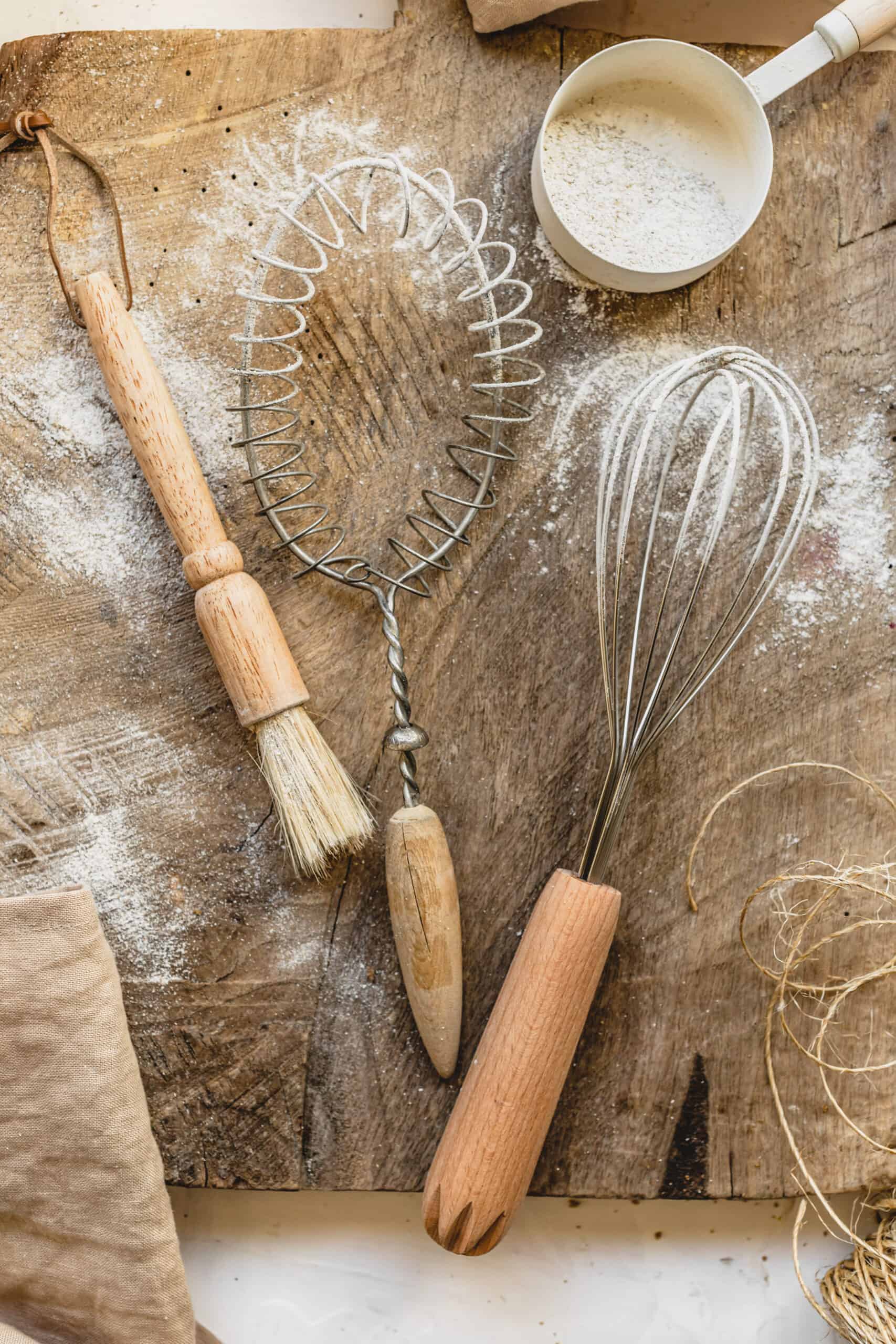 Tools used to mix up this Vegan Apple Crumble on a wood cutting board.