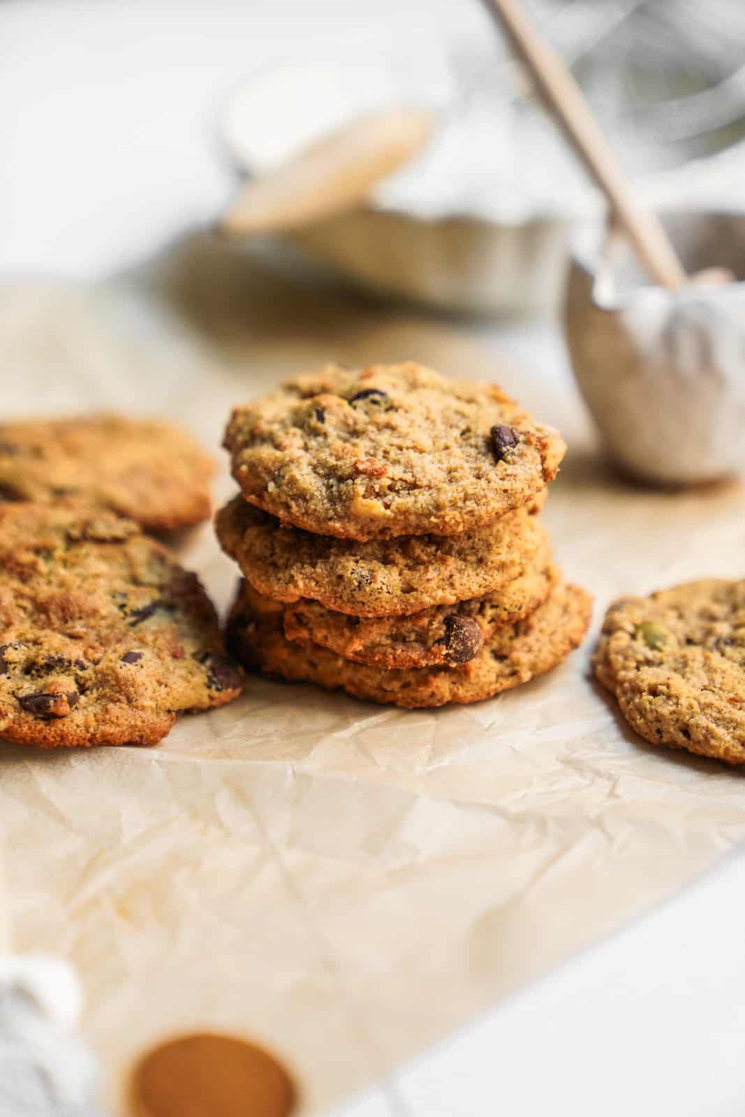 Stacks of Granola Chocolate Chip Cookies on parchment paper