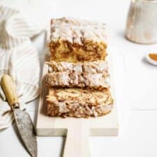 Vegan Cinnamon Bun Bread sliced on cutting board