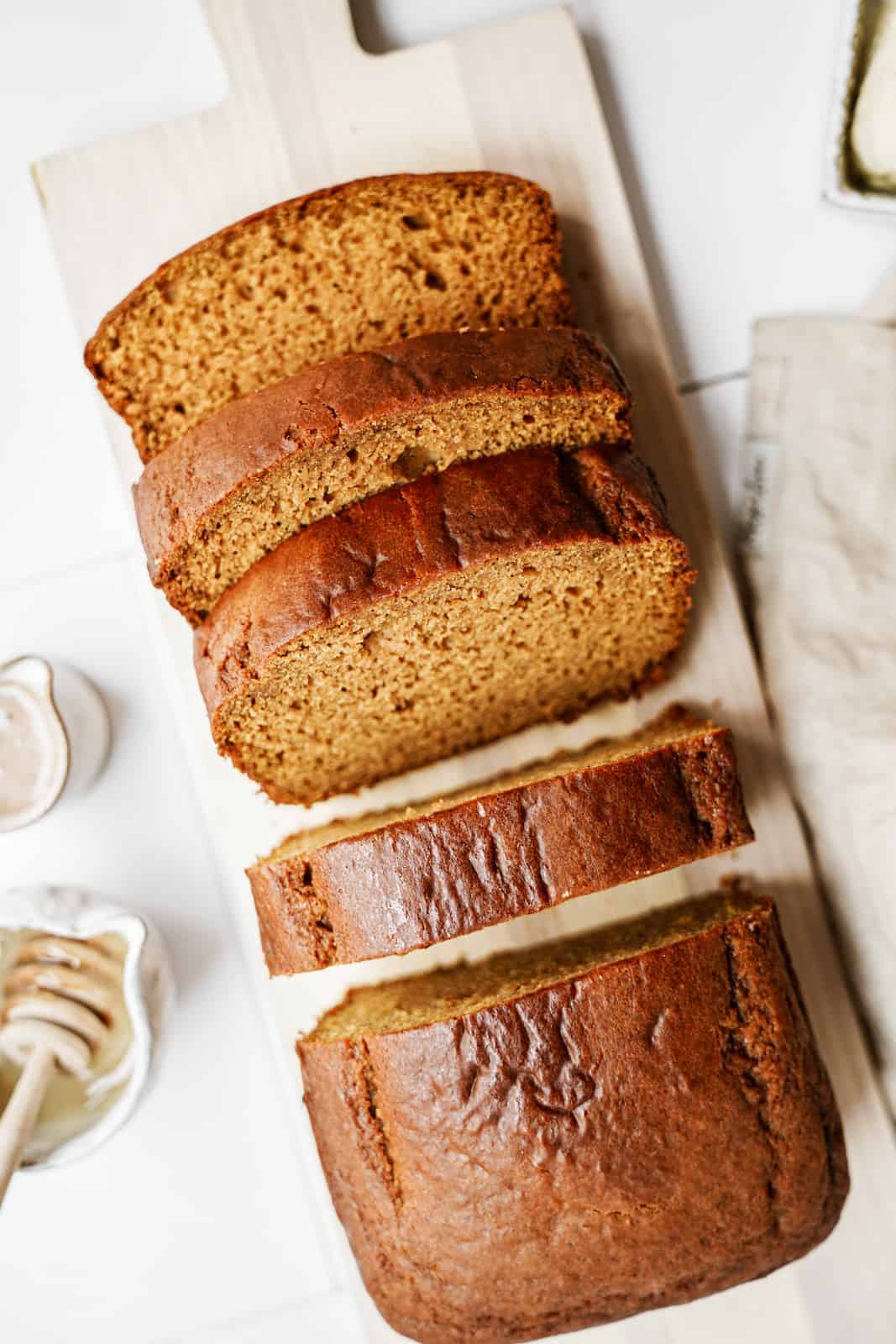 vegan pumpkin bread recipe on cutting board, sliced