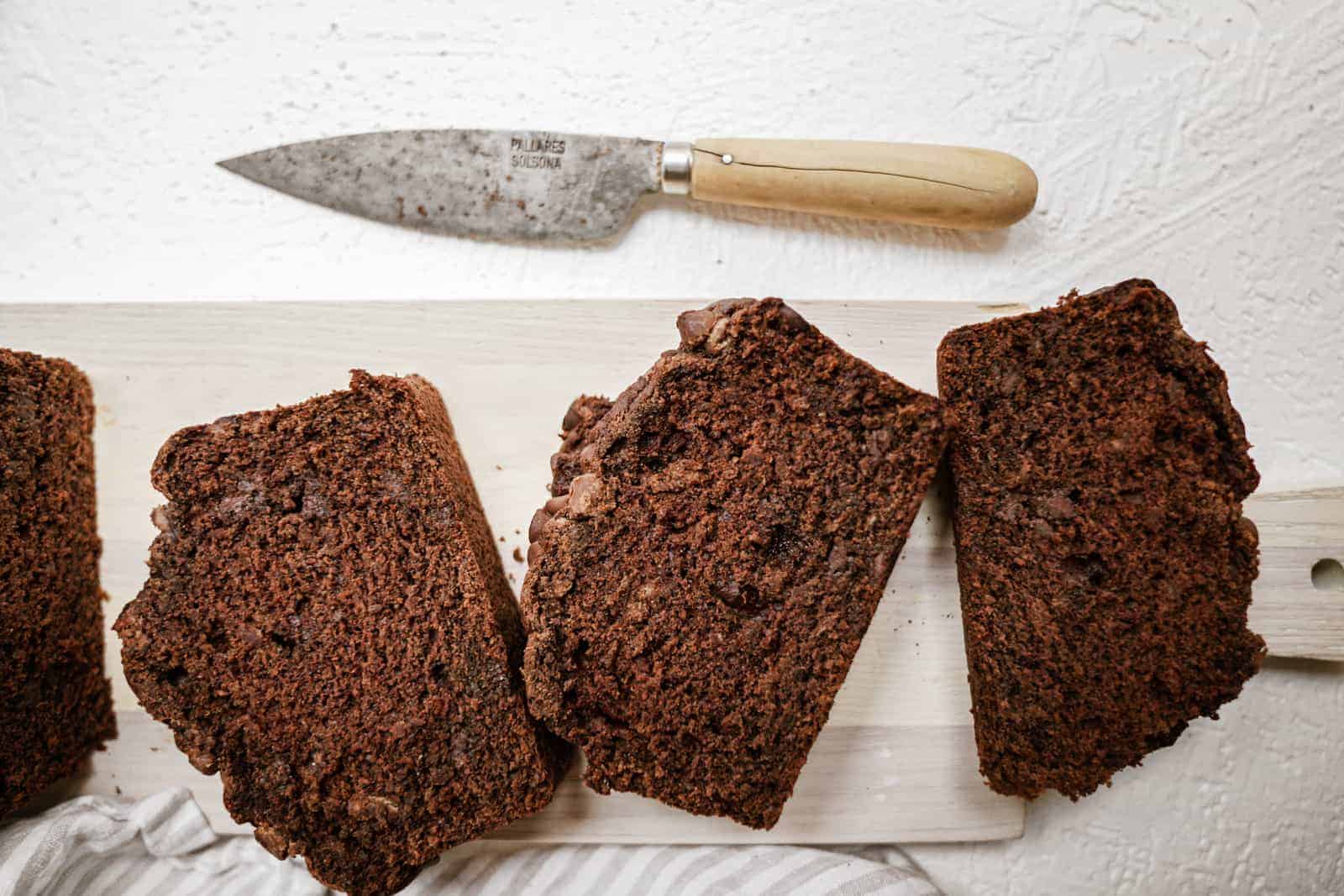 Slices of chocolate banana bread on cutting board