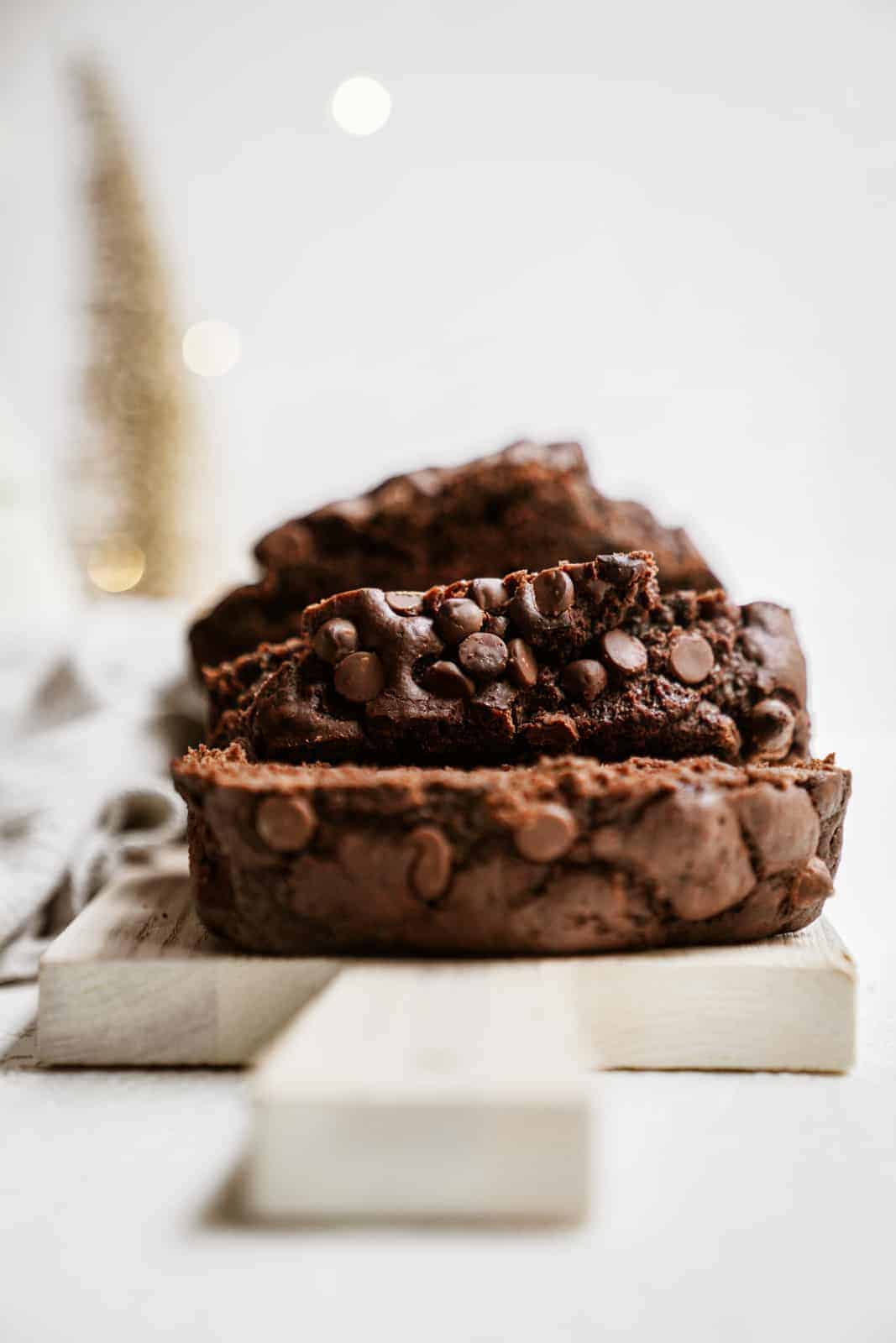 Close-up of sliced chocolate banana bread on cutting board