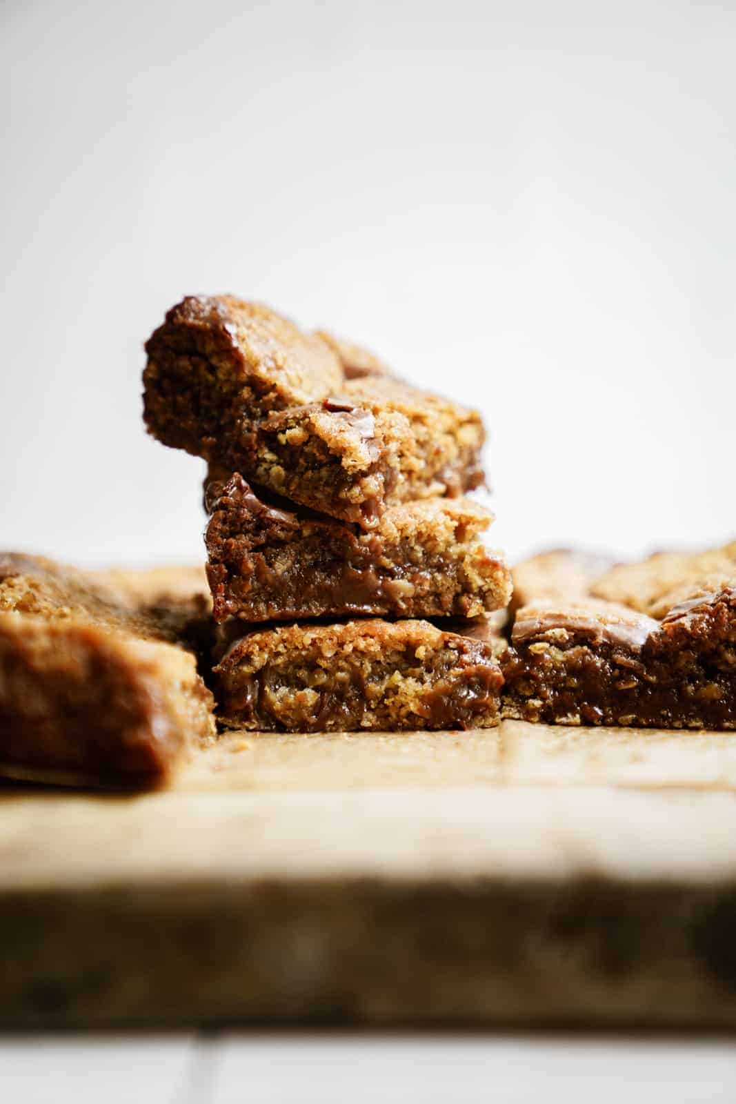 Stack of Oatmeal Fudge Bars on cutting board