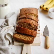 Healthy Banana Bread Recipe presented on a cutting board.