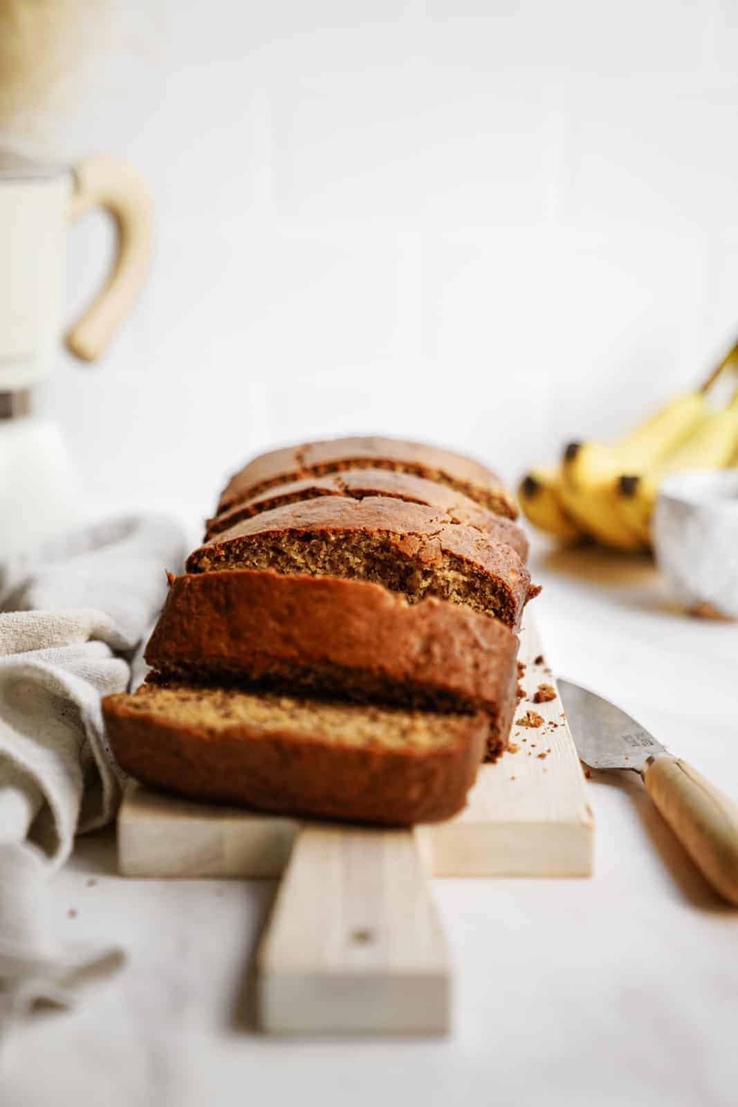 Healthy Banana Bread Recipe presented on a cutting board.