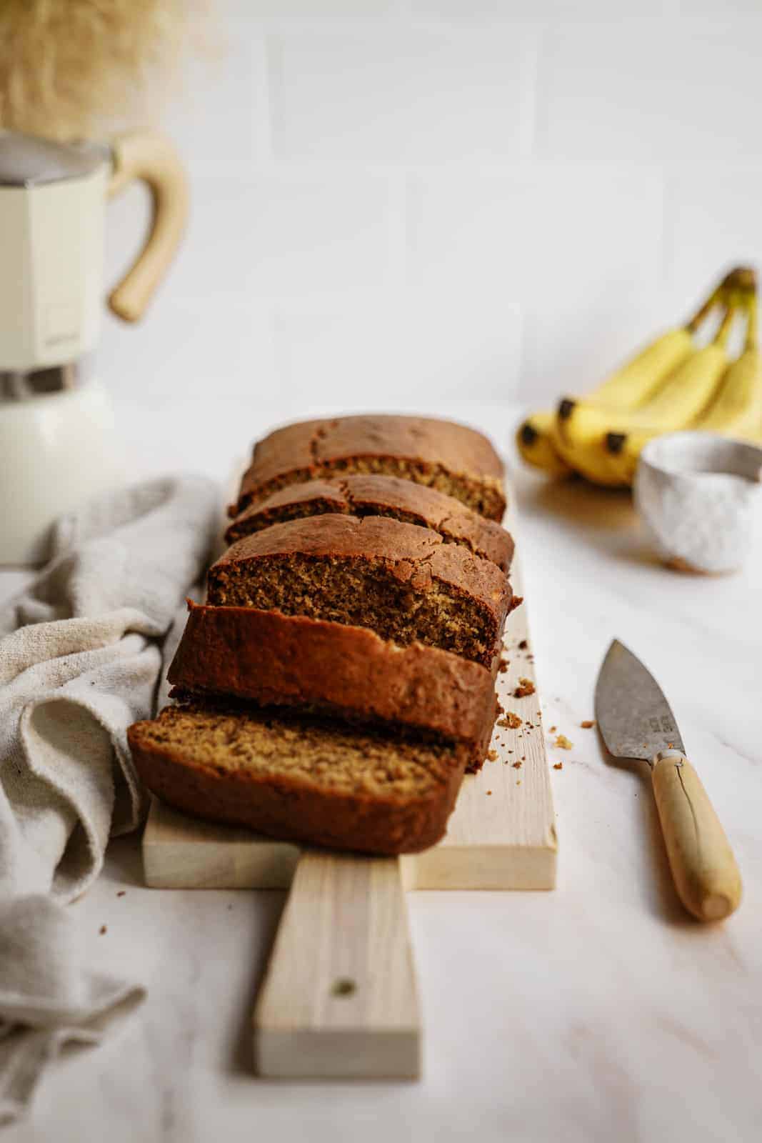 Healthy Banana Bread Recipe presented on a cutting board.