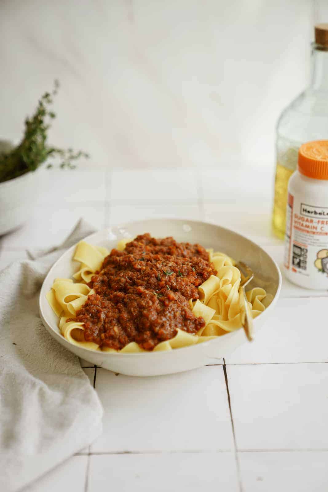 Vegan ragu in a serving dish on countertop