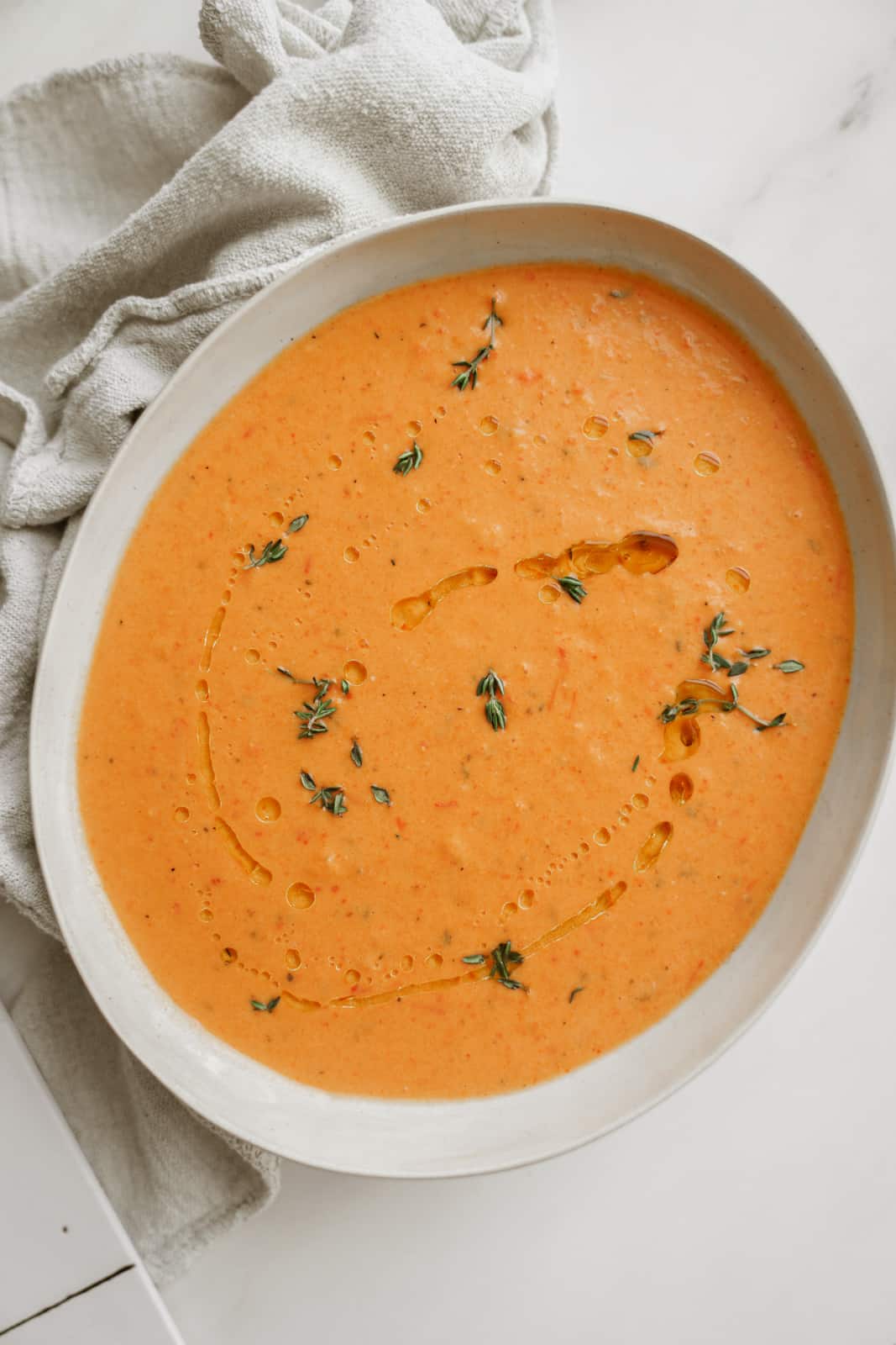 Big bowl of Roasted Red Pepper Soup on counter