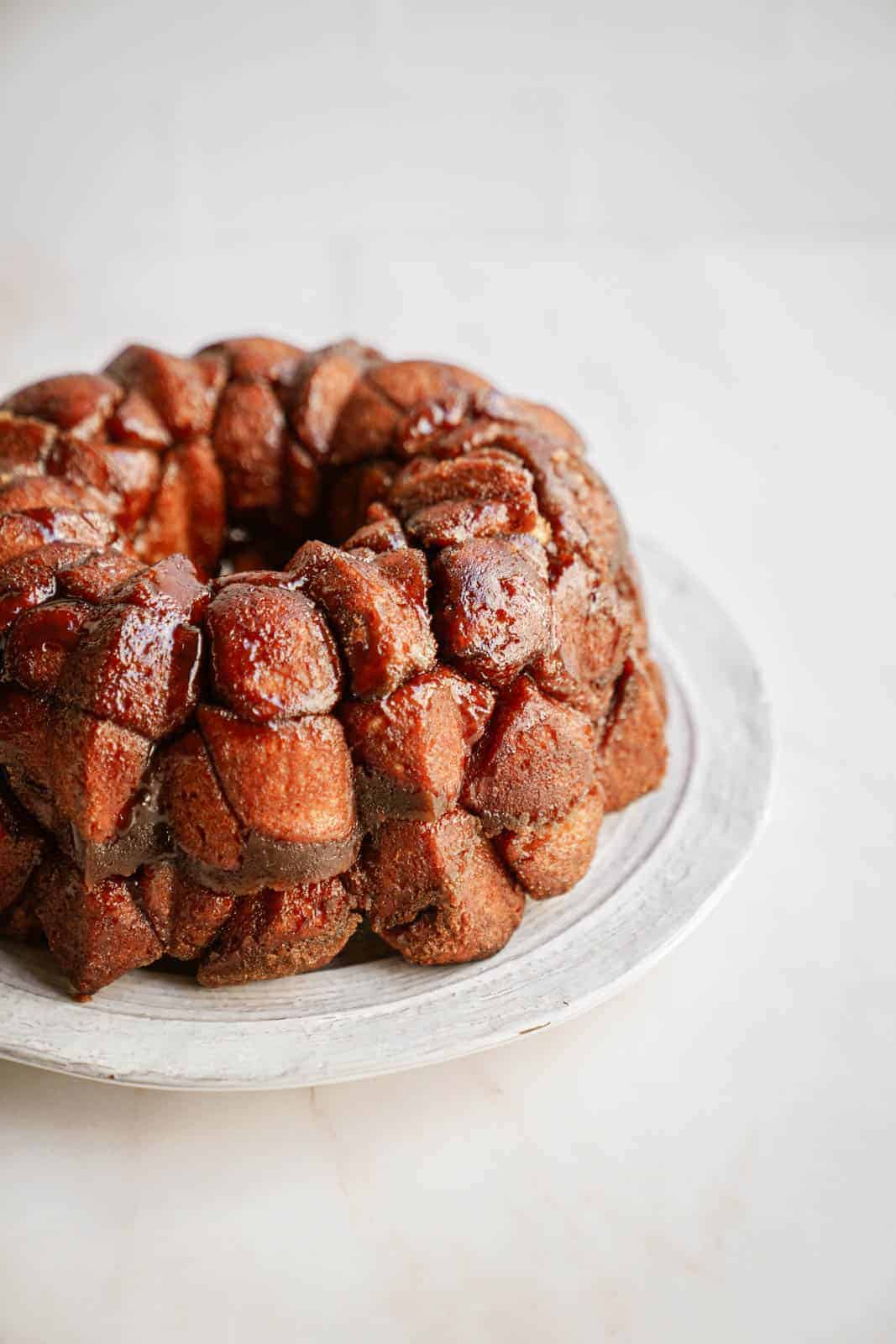 Vegan monkey bread on plate not yet drizzled with icing.