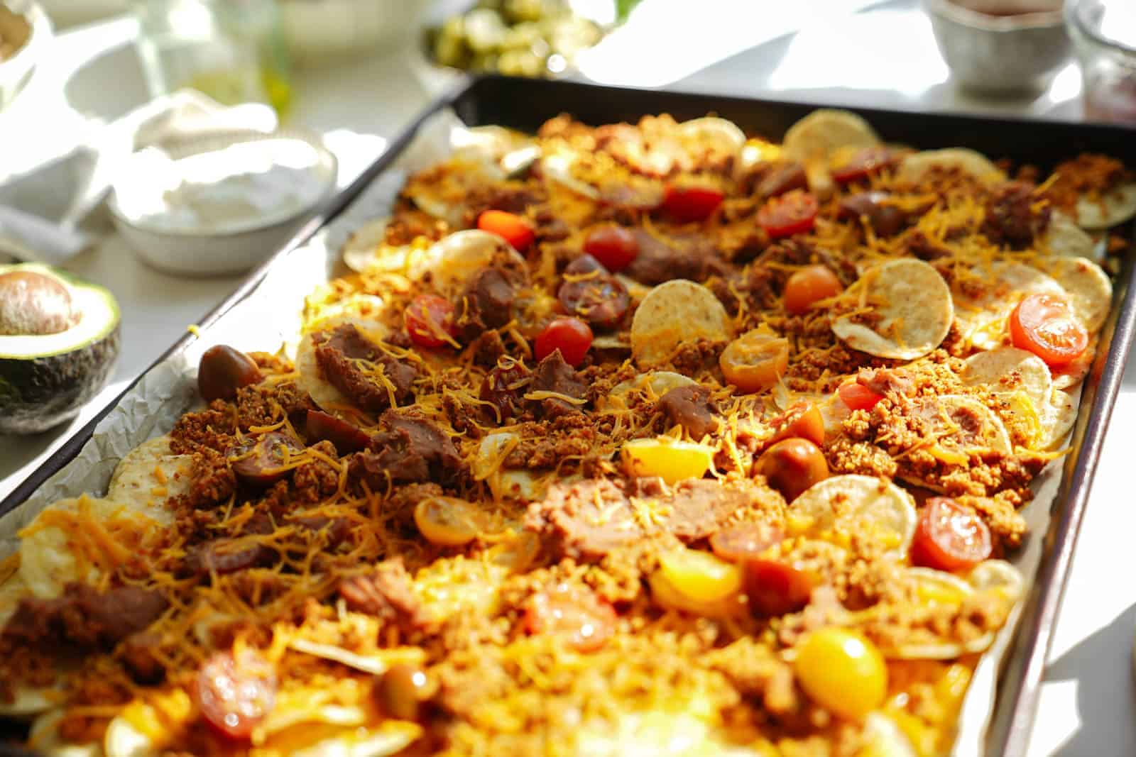 Vegan Taco Meat Nachos on a big baking sheet