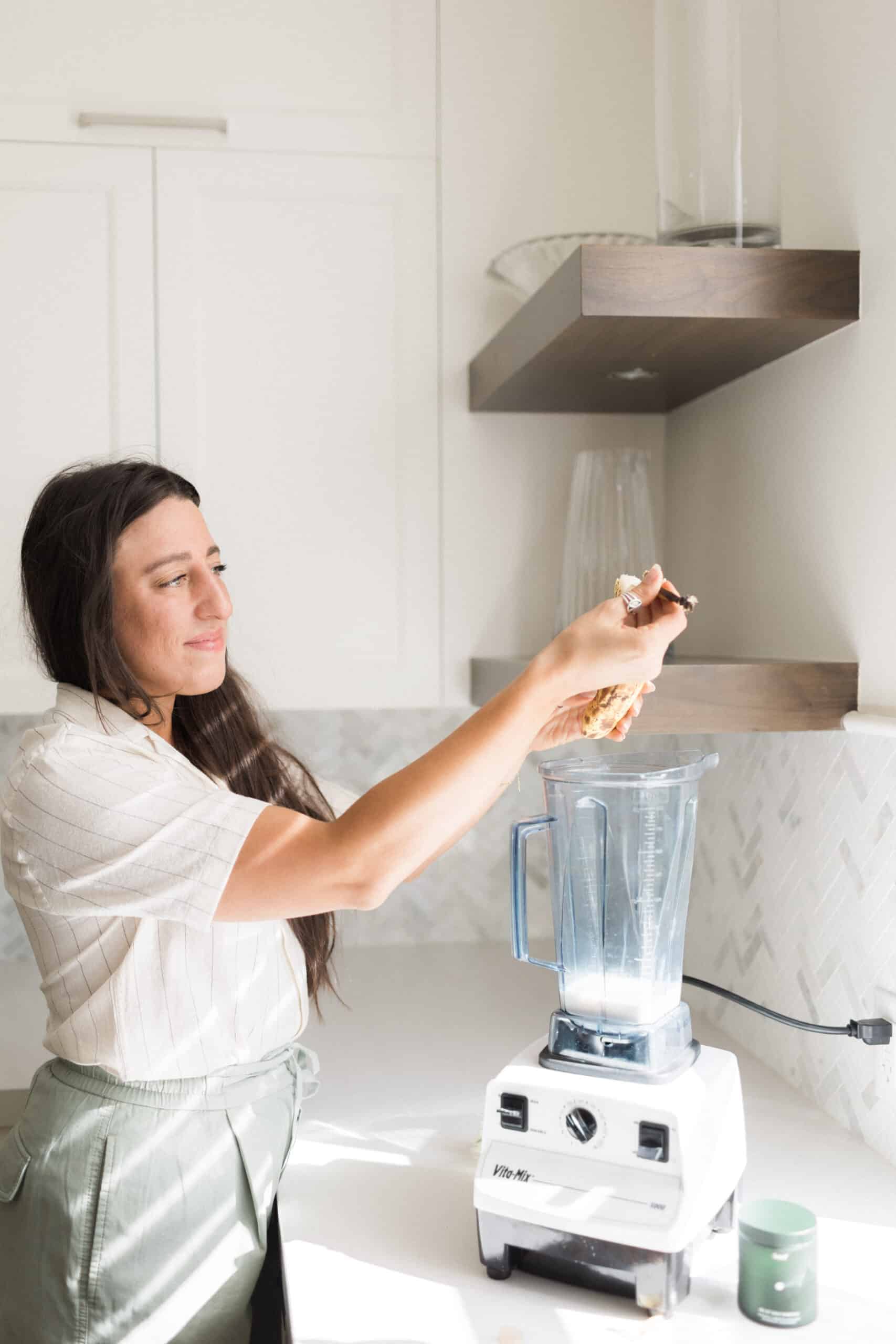 Maria putting ingredients in blender for a healthy smoothie