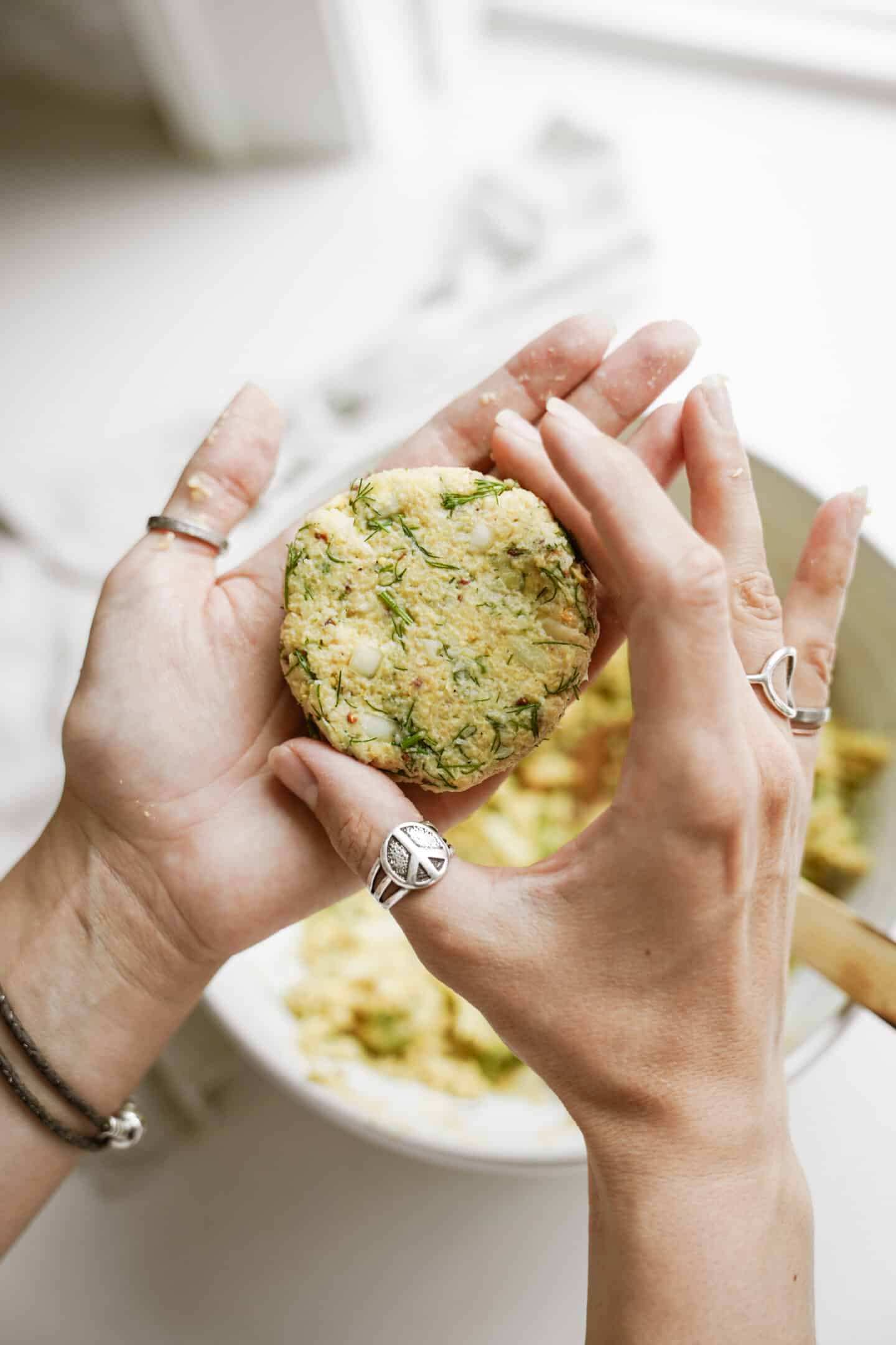 Hands forming vegan crab cakes