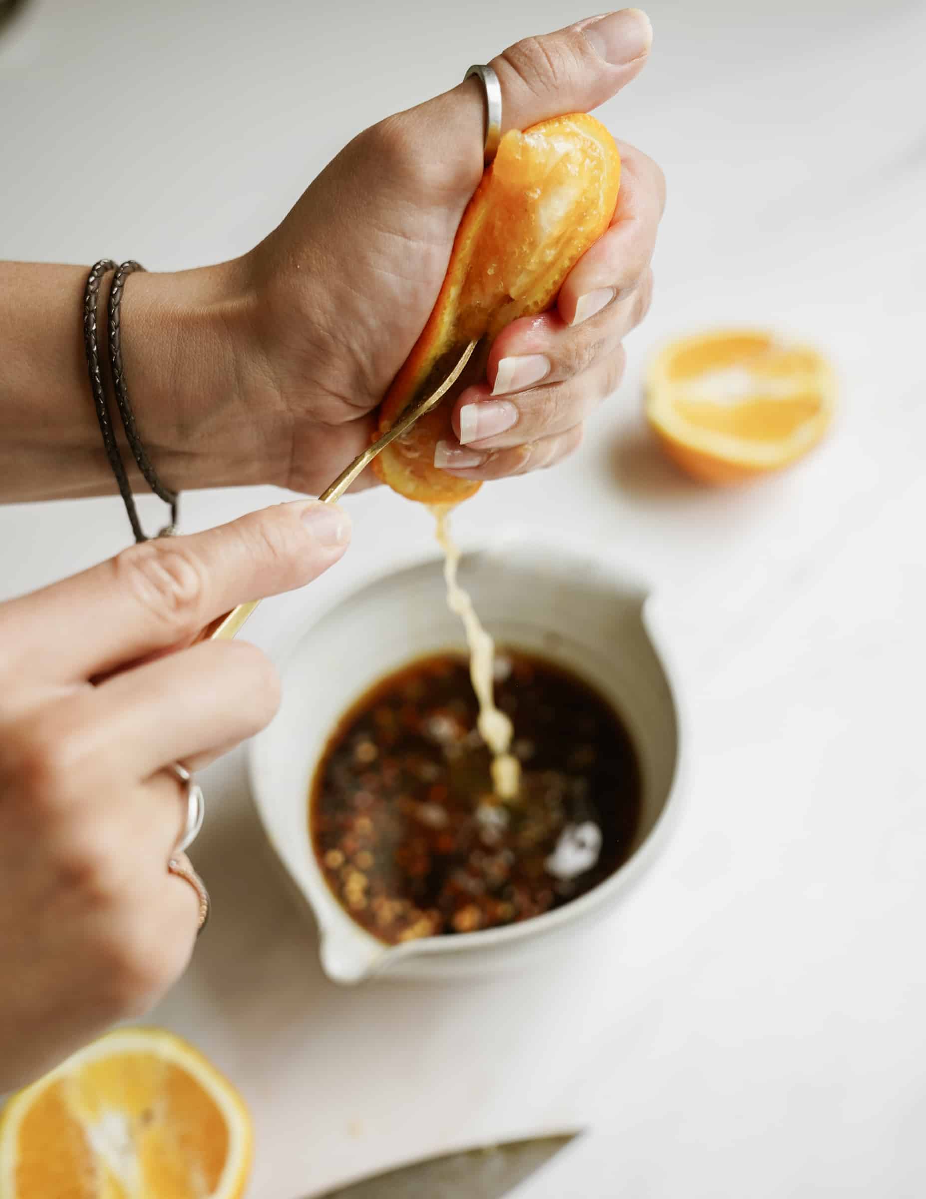 Ingredients being mixed in a bowl for sticky sesame sauce