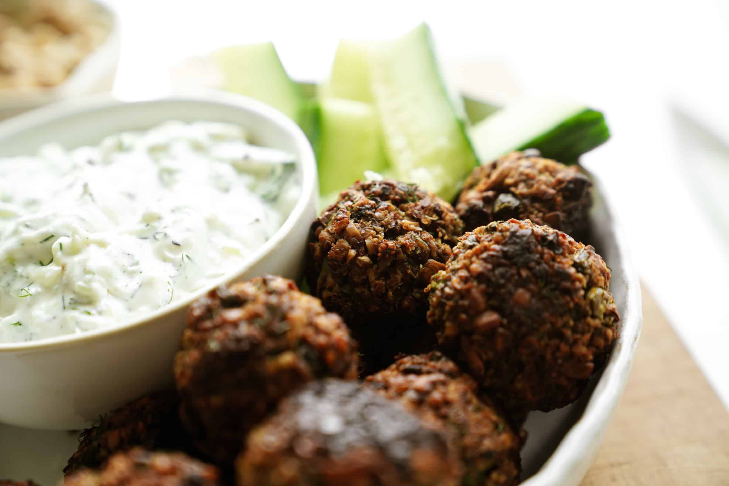 Walnut meatballs close-up on a serving dish 