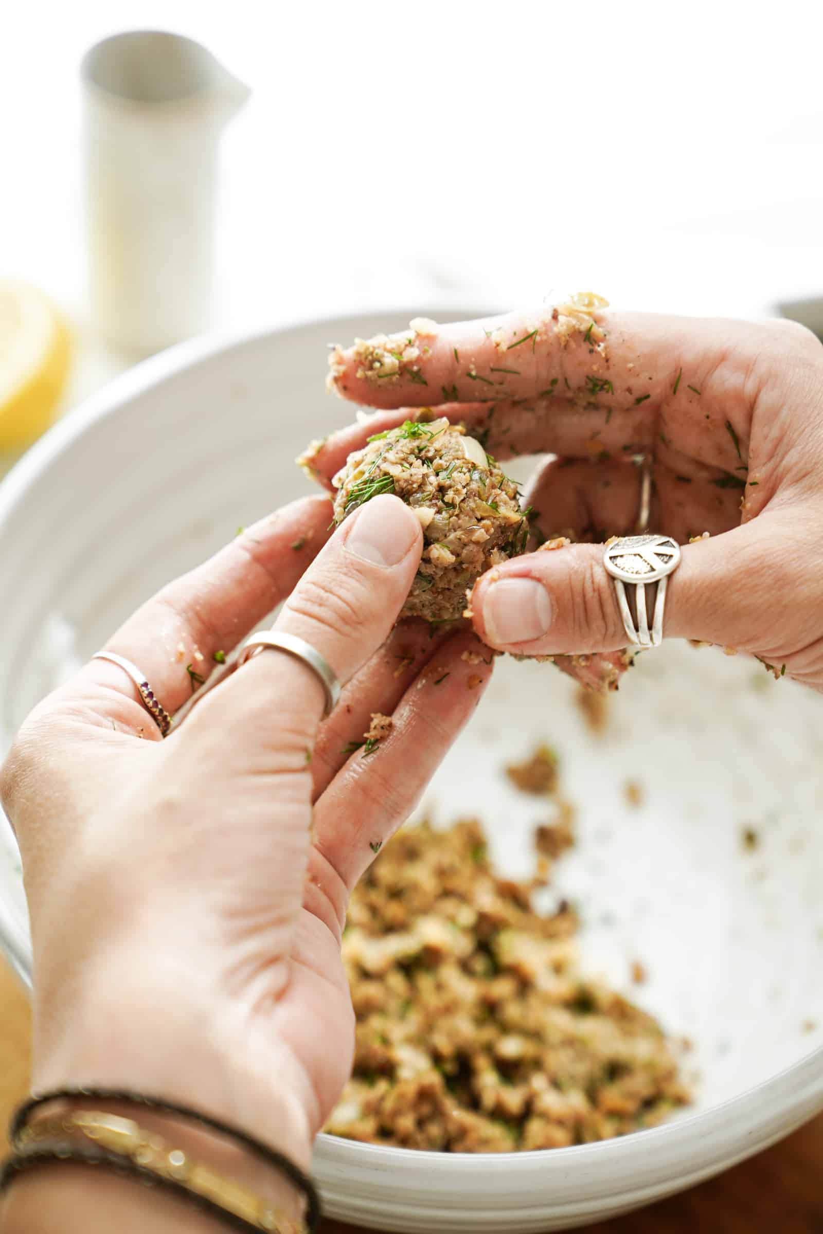 Forming walnut meatballs into balls